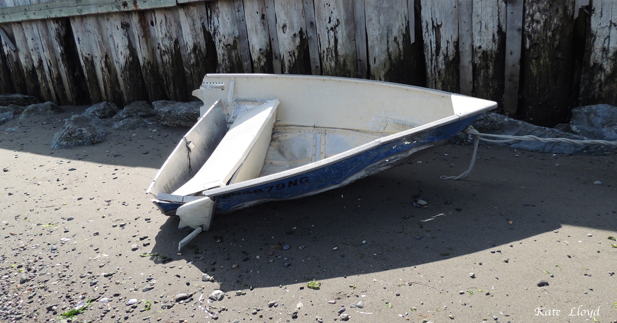 The high winds and waves slashed this boat in half. Many boats were lost; ours was safe onshore.