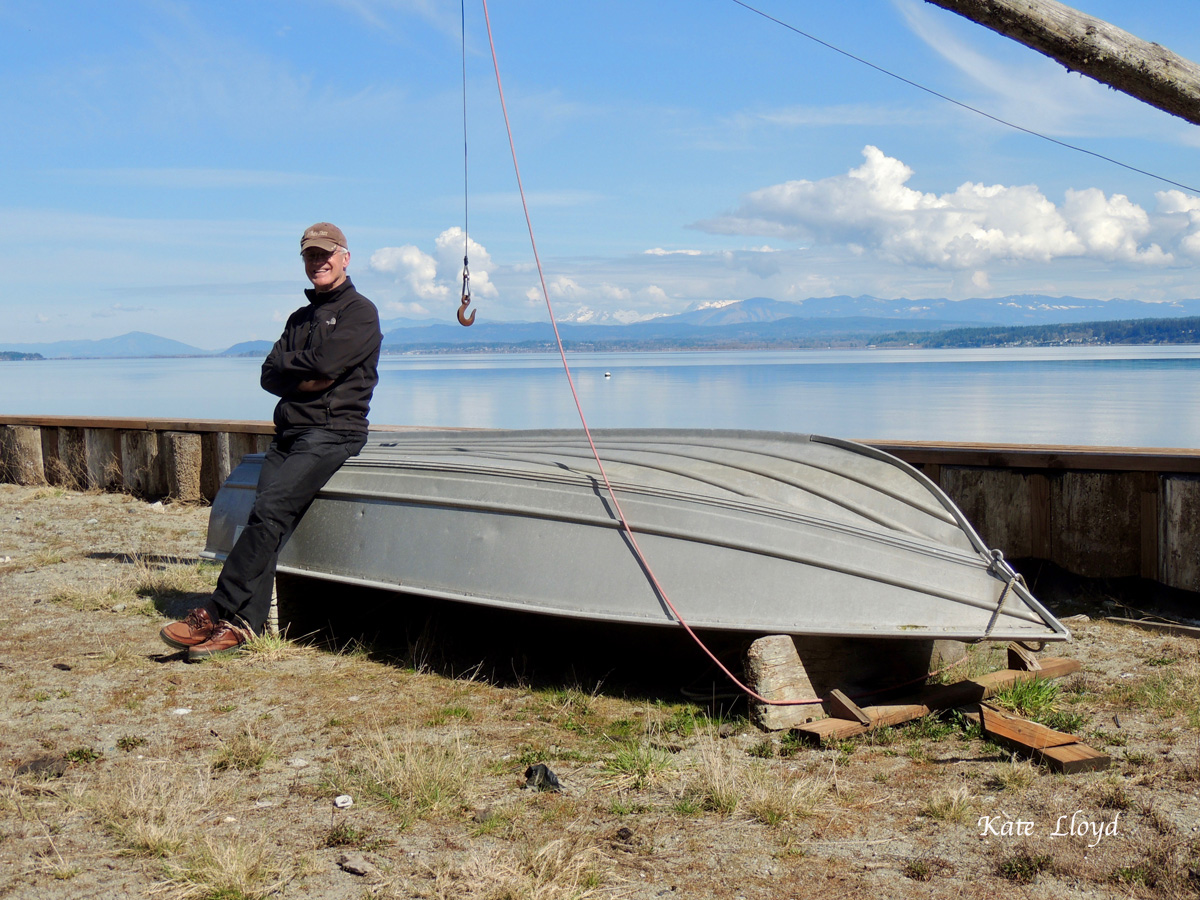 My husband with our boat. Perfect for pulling up crab-pots!